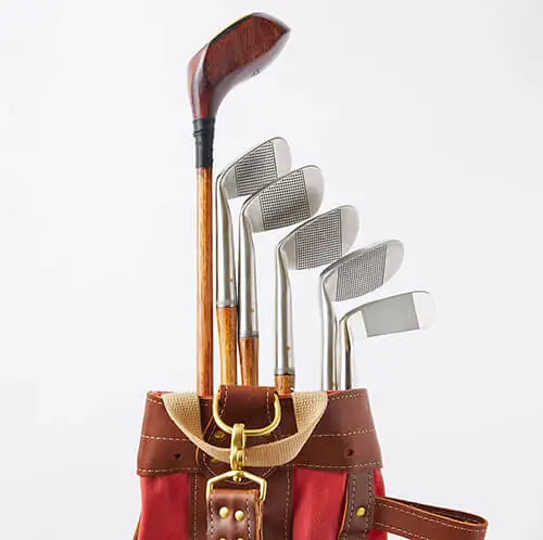 A set of hickory club in a vintage golf bag